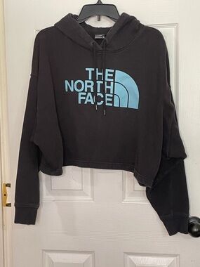 The North Face Black Cropped Hoodie with Light Blue Logo. Size XL